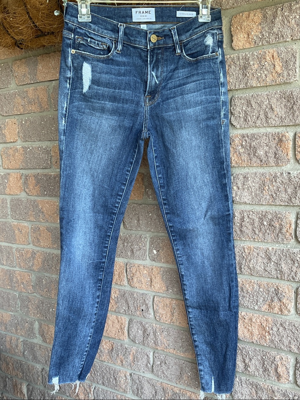 Frame Denim Dark Blue Skinny Jeans with Subtle Distressing